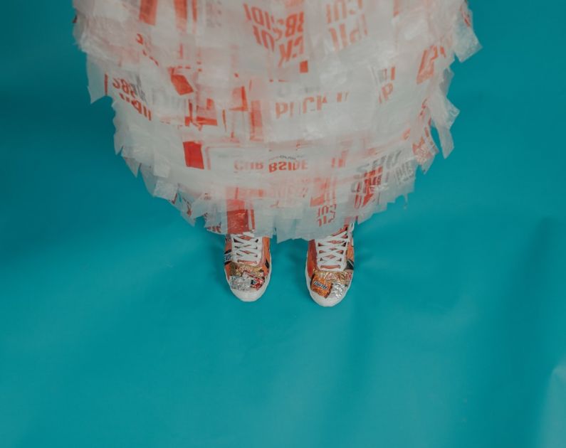 Eco Materials - person wearing brown-and-white lace-up shoes