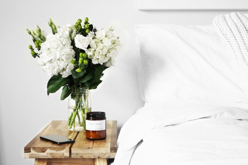 Sustainable Decor - flowers in clear glass vase on table