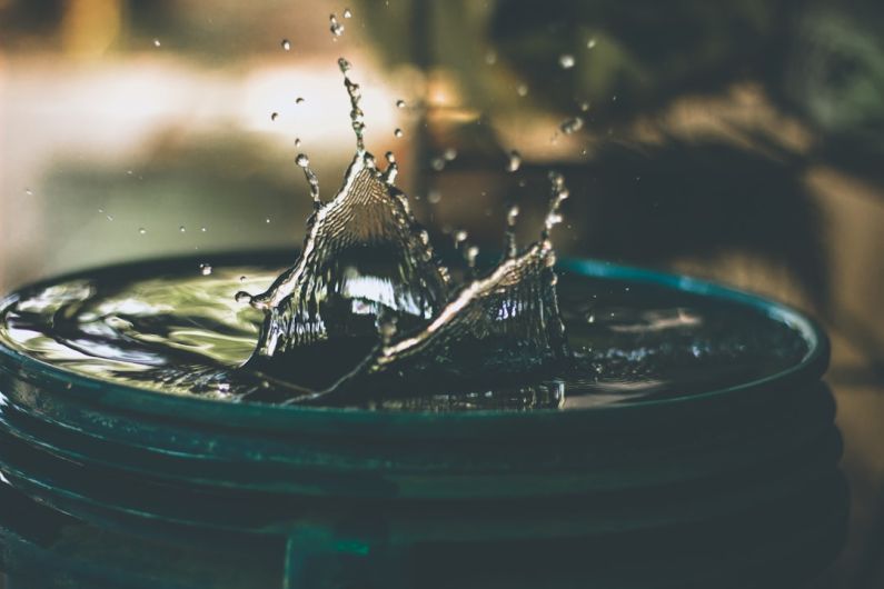Water Saving - water drop on bucket photo