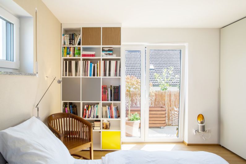 Sustainable Furniture - white wooden shelf with books