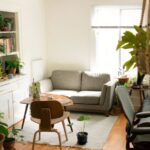 Small Apartment - gray fabric loveseat near brown wooden table