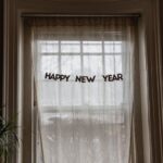 New Years Decor - white window curtain during daytime