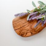 Aromatherapy Decor - green and purple leaves on brown wooden chopping board