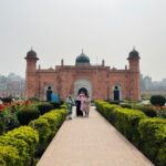 Water Features - a couple of people that are standing in front of a building