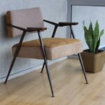 Ergonomic Furniture - brown fabric padded armchair beside green snake plant inside room