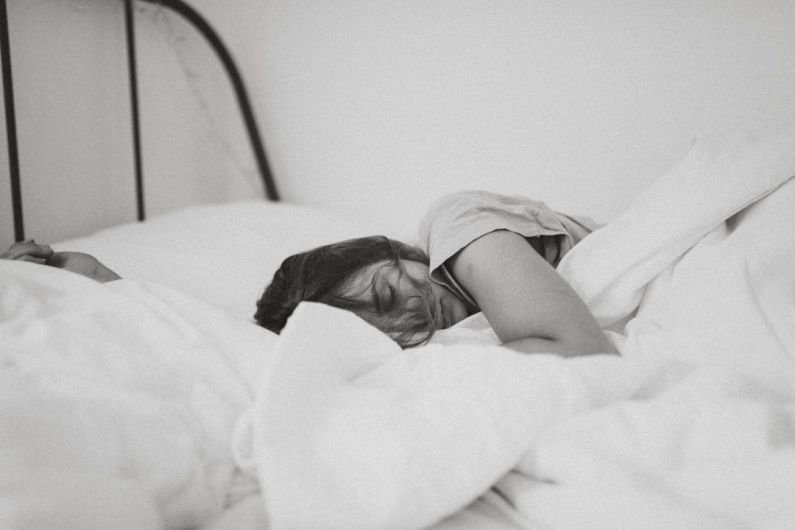 Under-bed Storage - grayscale photo of sleeping woman lying on bed