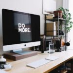 Dual-purpose Furniture - silver iMac with keyboard and trackpad inside room