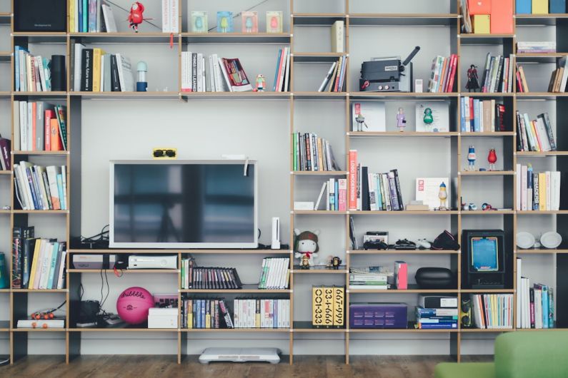 Garage Organization - flat screen TV on brown wooden shelf