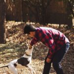 Outdoor Pet - man playing with dog